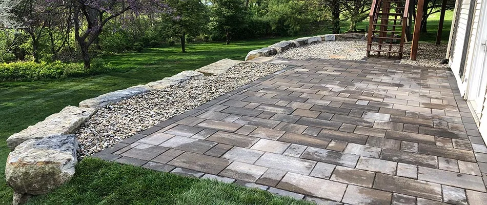 Paver patio and pea gravel installed in Edwardsville, Illinois.