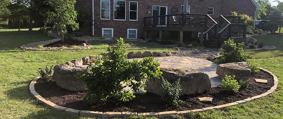 A newly built flagstone patio in our client's backyard in Edwardsville, IL.
