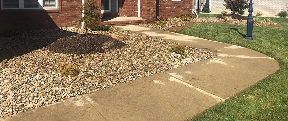 Our recent client's landscape beds topped with rock and mulch in Glen Carbon, IL.