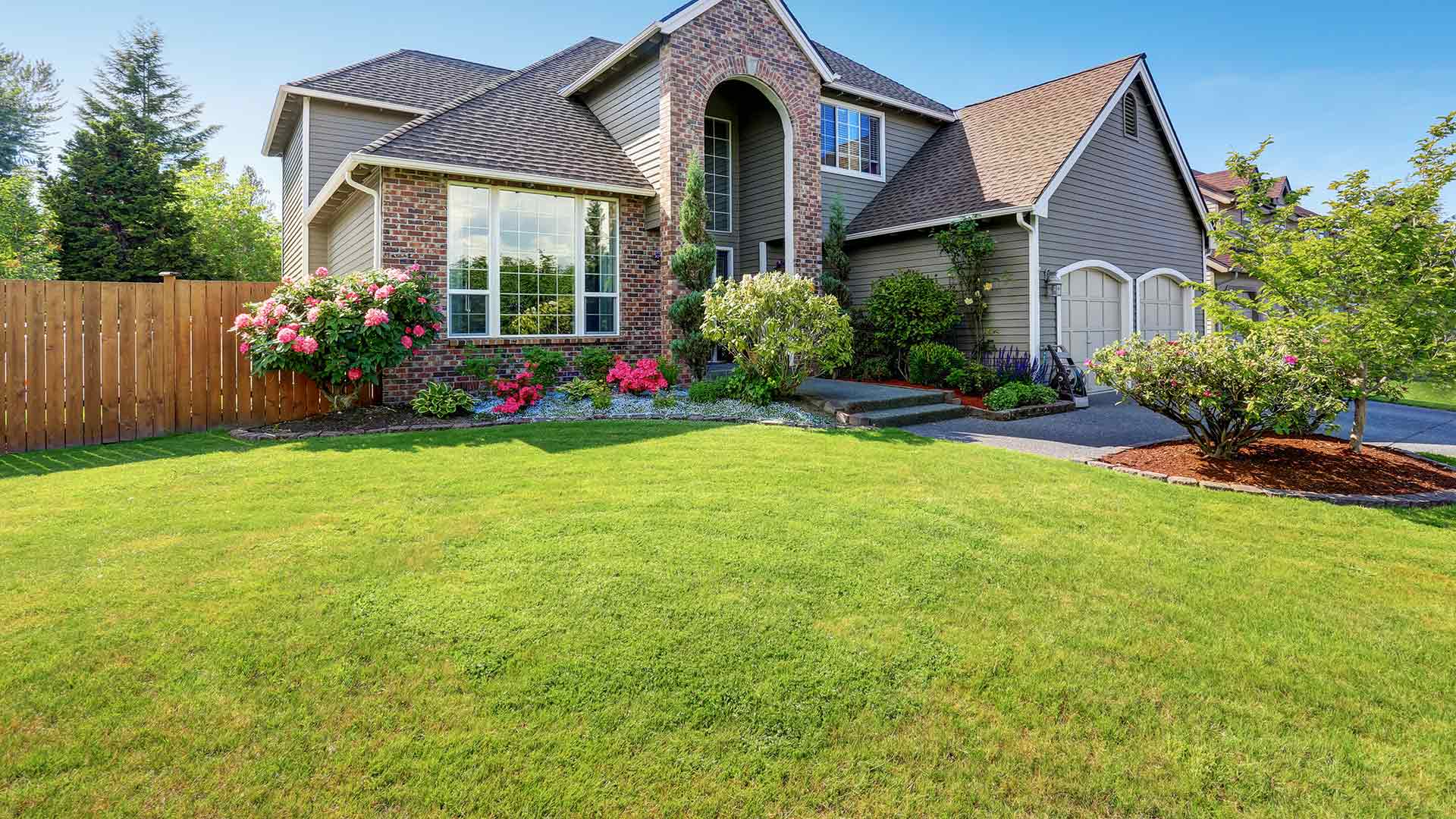 A home in Bethalto, IL with landscaping and lawn care service.