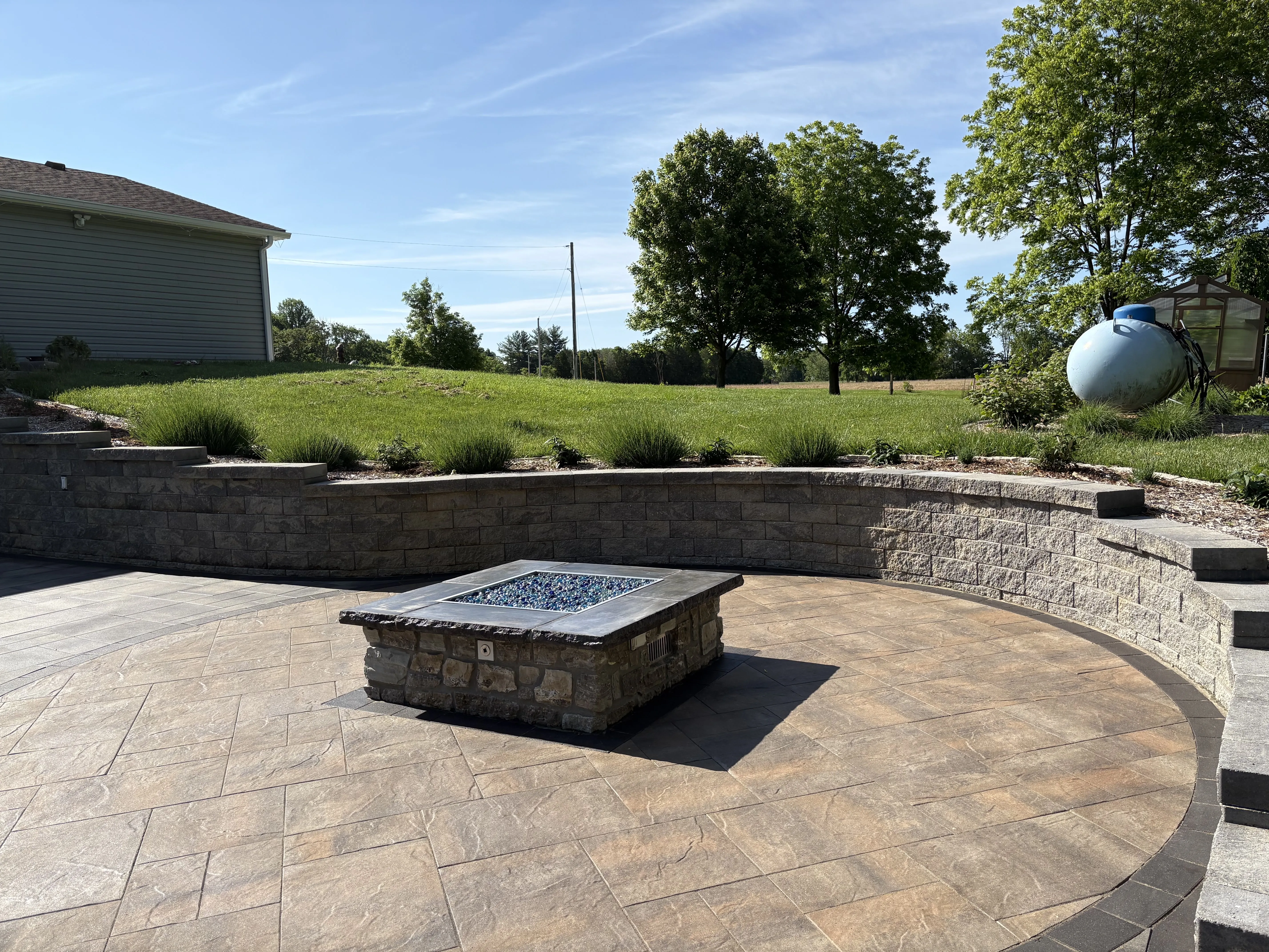Fire pit and seating wall at a home in Bethalto, Illinois.