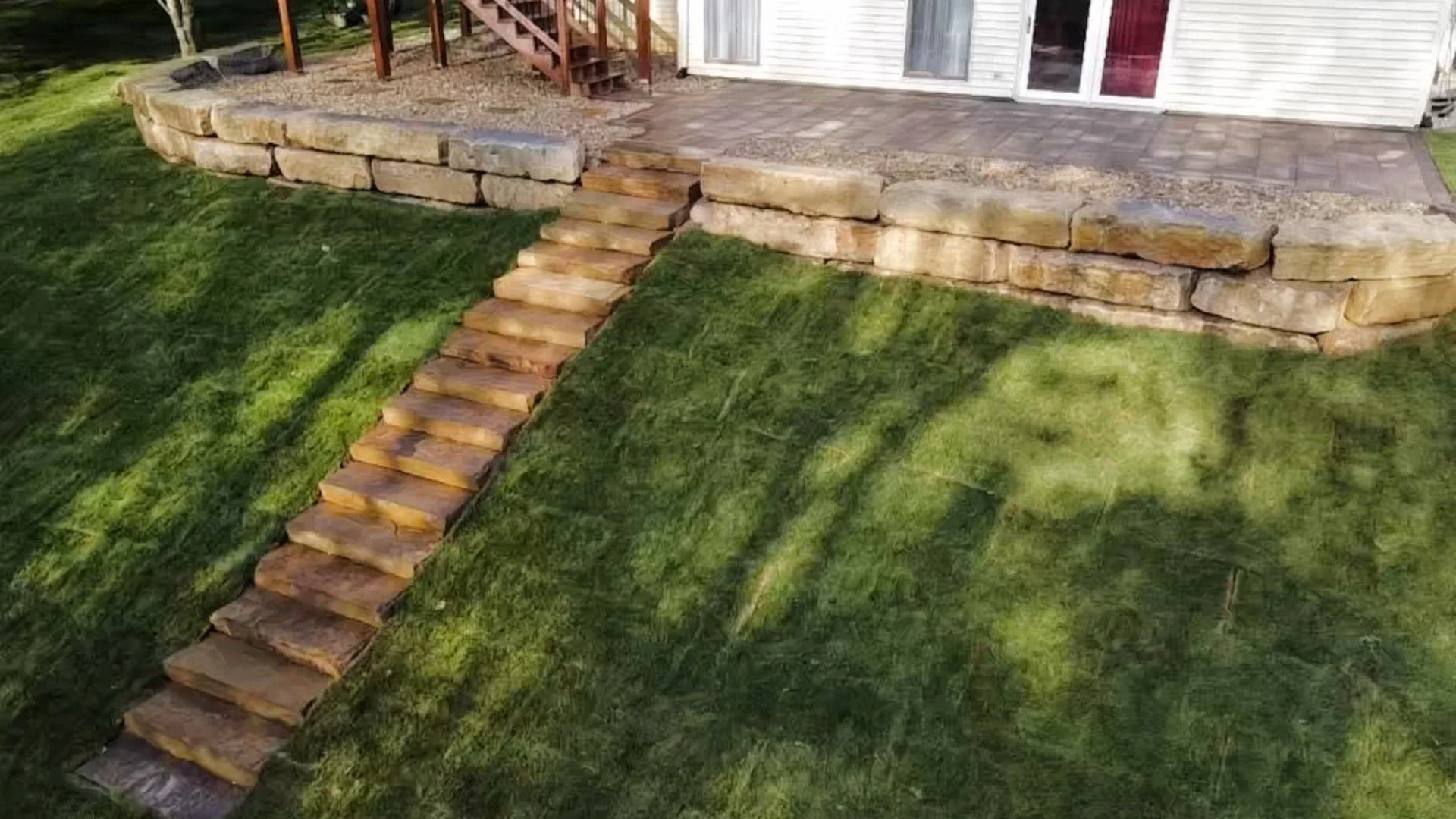 Outdoor steps installed by backyard in Highland, IL.