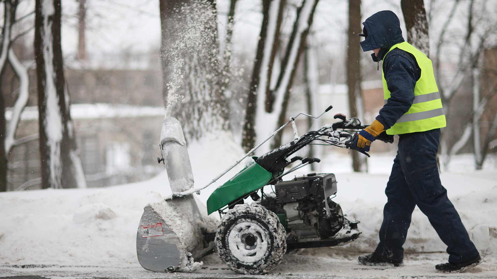 Snow blower and Creekside Landscapes worker in Edwardsville, IL.