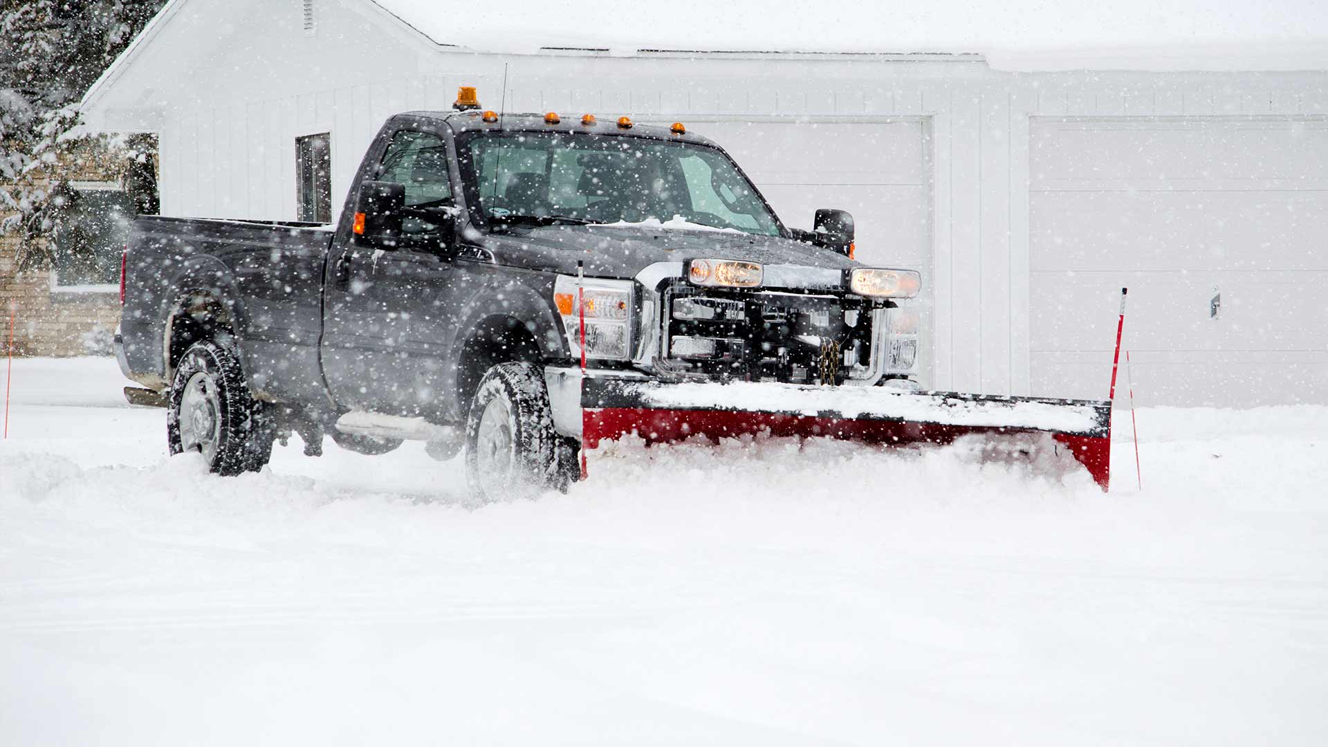 A work truck with a snow plow attachment near Edwardsville, IL.