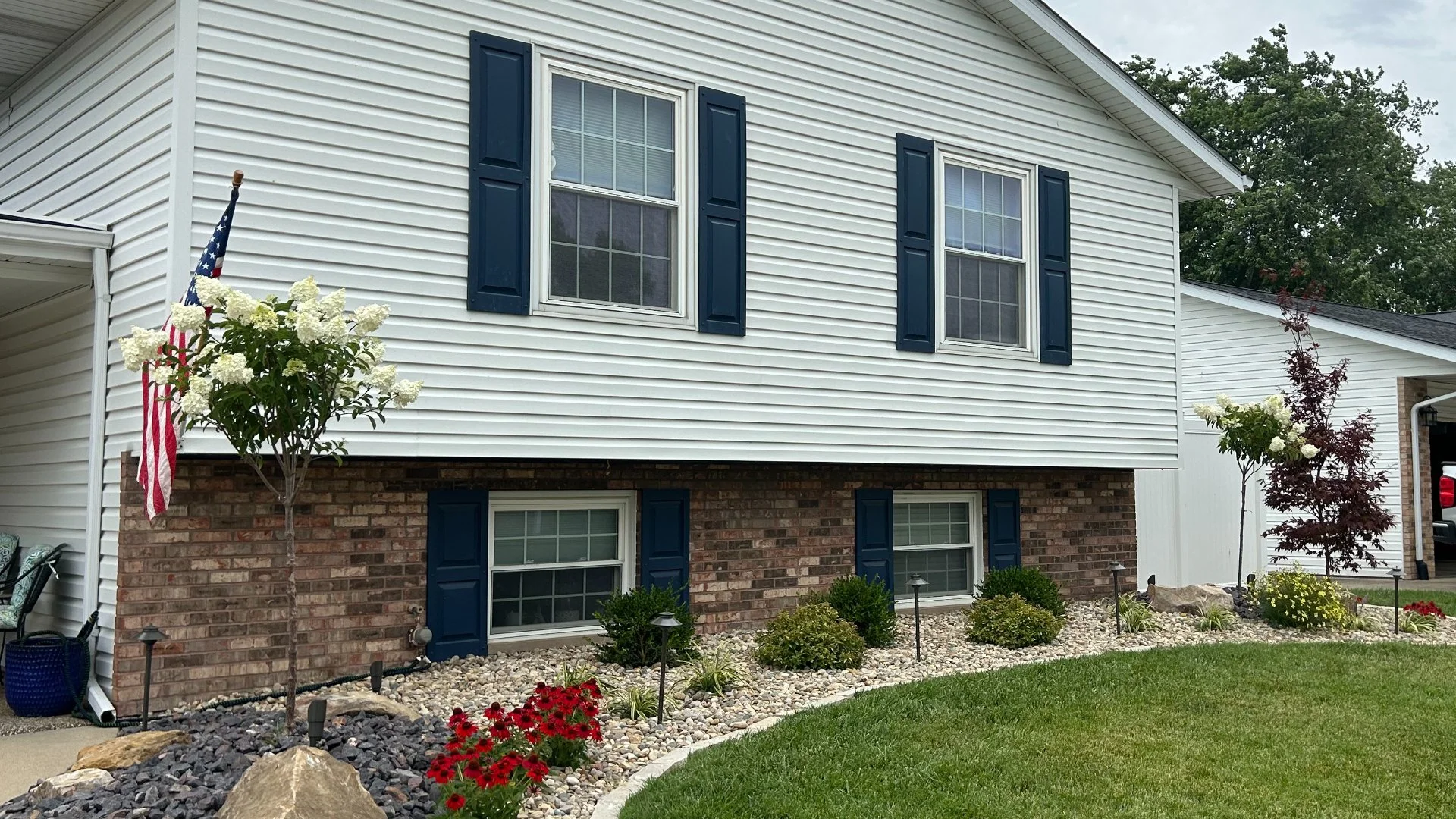 Landscape bed renovation with rock mulch near Edwardsville, Illinois.