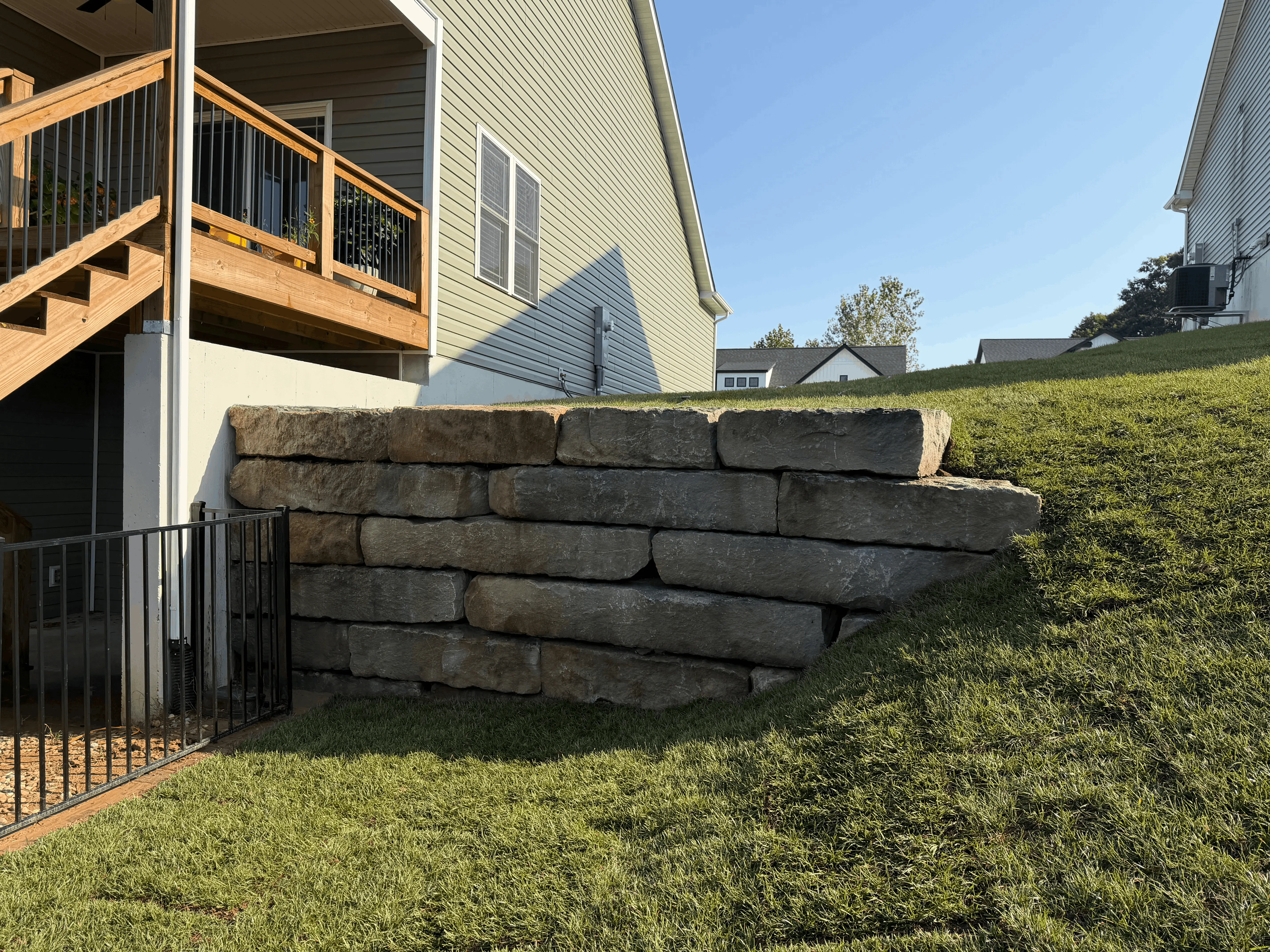 Landscape bed with retaining and seating wall near Bethalto, Illinois.