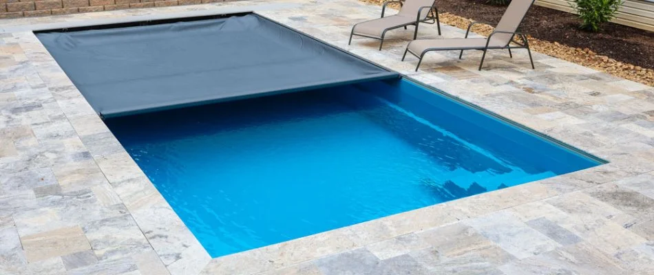 Automatic pool cover on a swimming pool in Edwardsville, IL.