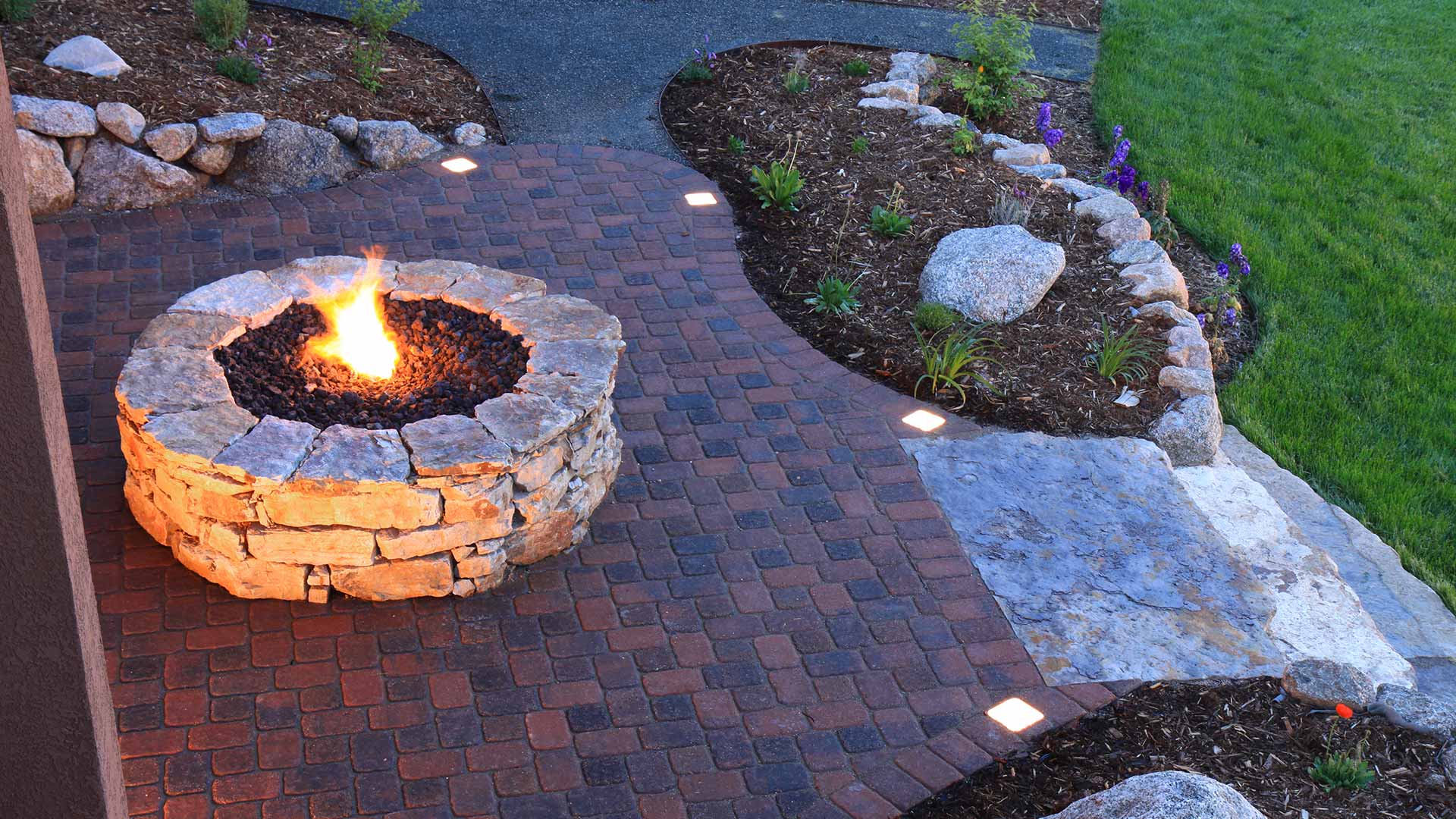 Should Your Outdoor Fire Feature Be Made of Bricks, Stones, or Boulders?