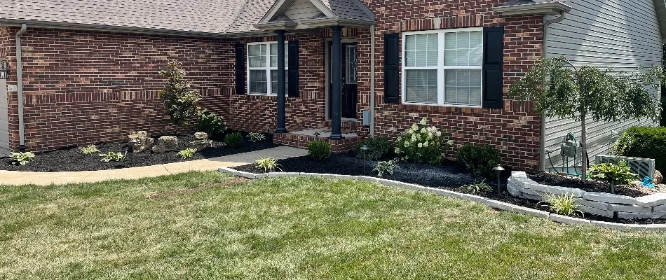 Brick house, landscape bed, and lawn in Edwardsville, IL.