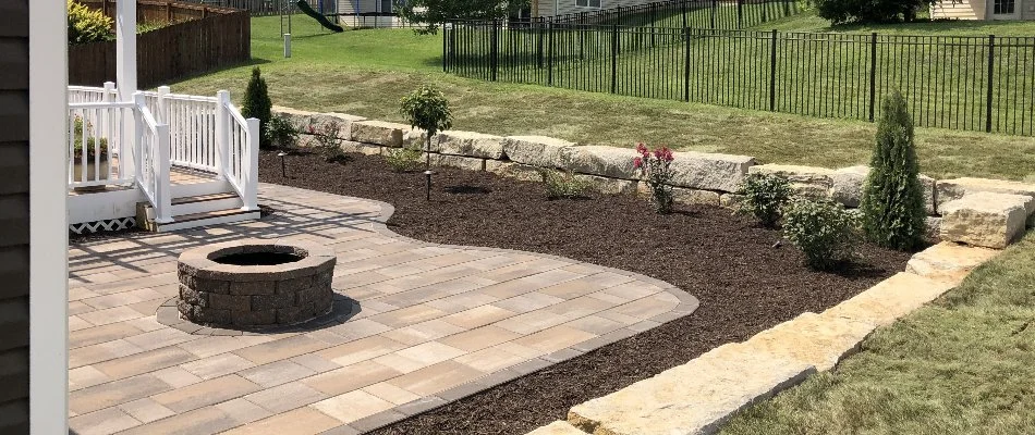 Fire pit and a paver patio in a backyard in Edwardsville, IL.