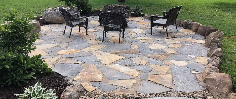 Flagstone patio in Edwardsville, IL, with chairs.