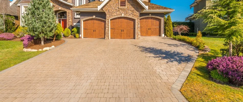 House in Edwardsville, IL, with a paver driveway and landscaping.