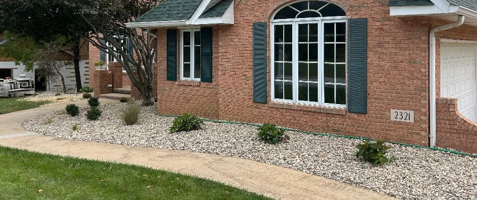 Landscape in Edwardsville, IL, with rocks and small plants.