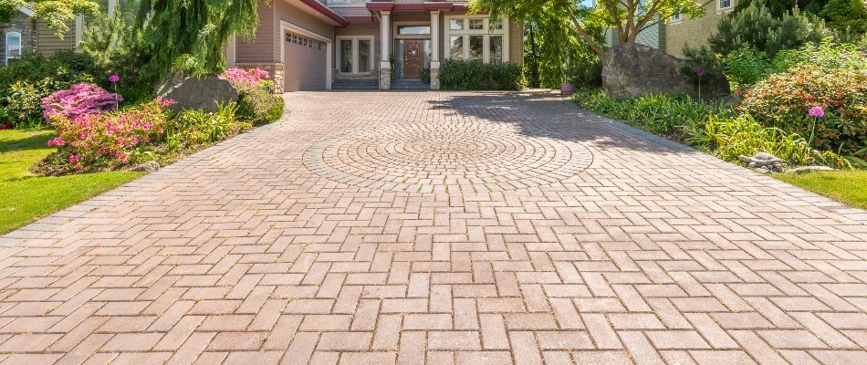 Long driveway in Edwardsville, IL, with a unique paver pattern.