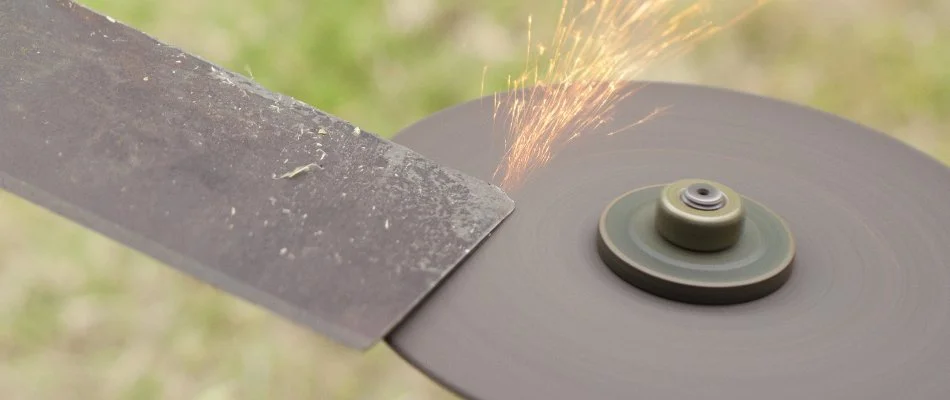 Mower blades being sharpened in Edwardsville, IL.