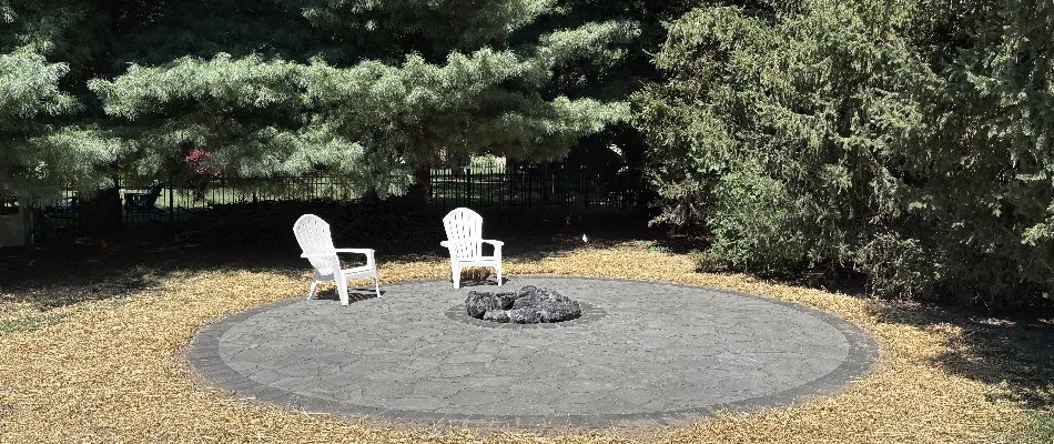 Paver patio in Edwardsville, IL, with a boulder fire pit.