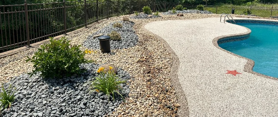 Rock landscape with plants around a pool in Edwardsville, IL.