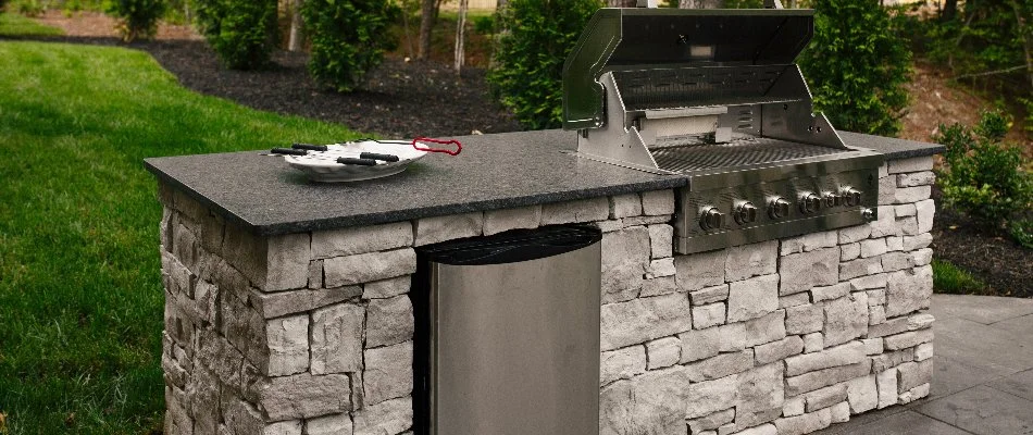 Stone outdoor kitchen with a grill in Edwardsville, IL.