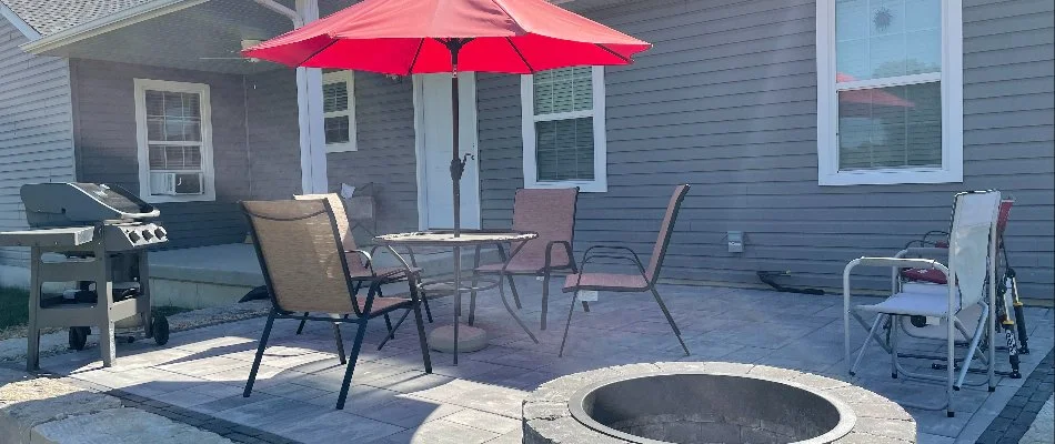 Inviting patio setup with grill and fire pit in Edwardsville, IL.