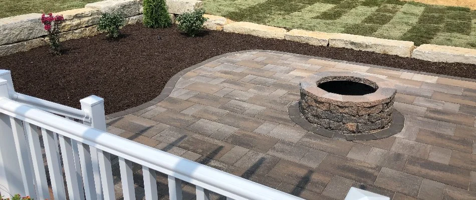 Circular fire pit in the center of a patio in Edwardsville, IL.
