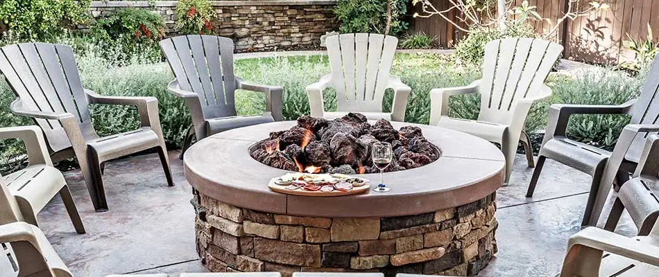 Patio and fire pit area with seating at a home in Bethalto, IL.