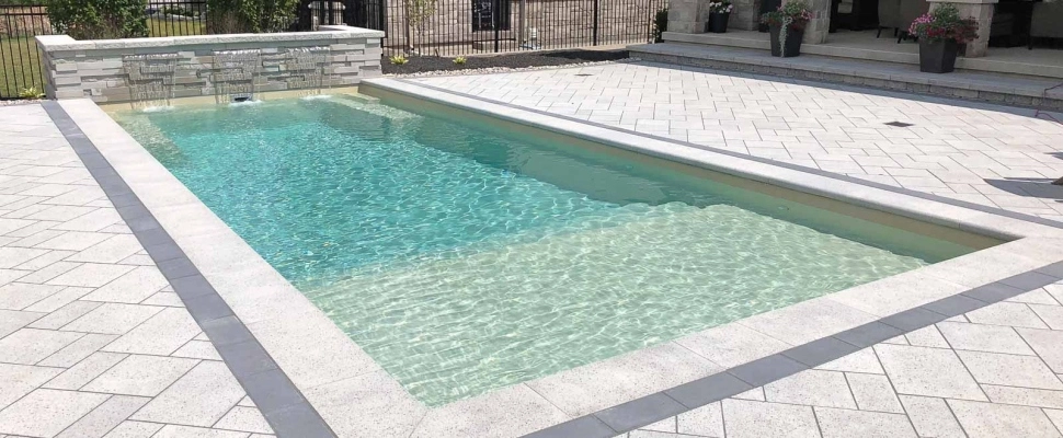 Custom swimming pool project with water features at Edwardsville, IL home.