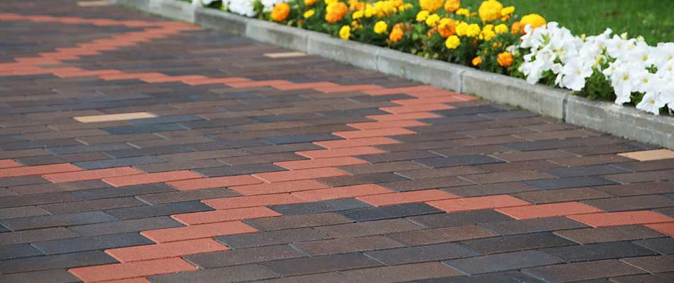 Decorative paver driveway design and installation at a home in Bethalto, Illinois.