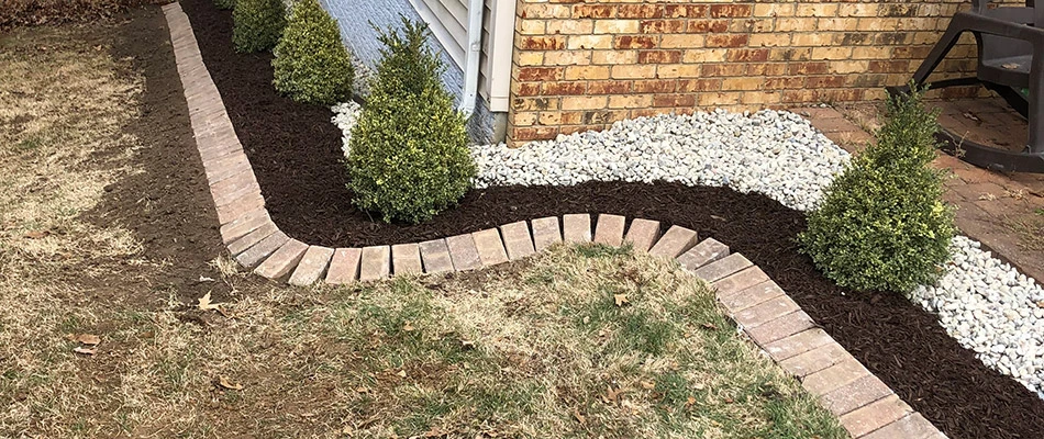A drainage system installed along a landscape bed a home in Bethalto, Illinois.