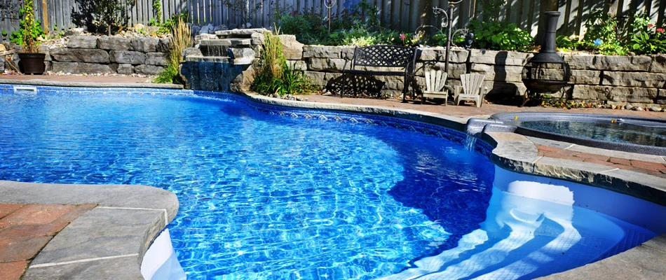Fiberglass swimming pool installed for landscape in Glen Carbon, IL.