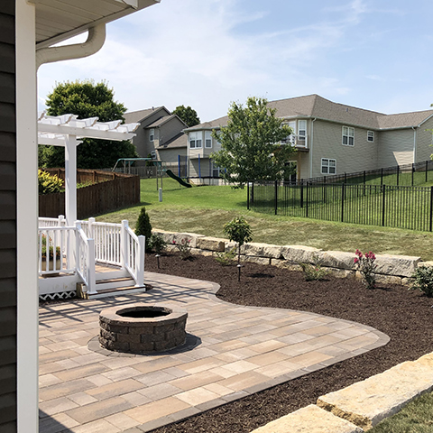 A lovely patio and firepit with new landscaping around it near Edwardsville, IL.