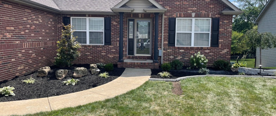 Installed mulch and plantings for landscape bed in Maryville, IL.