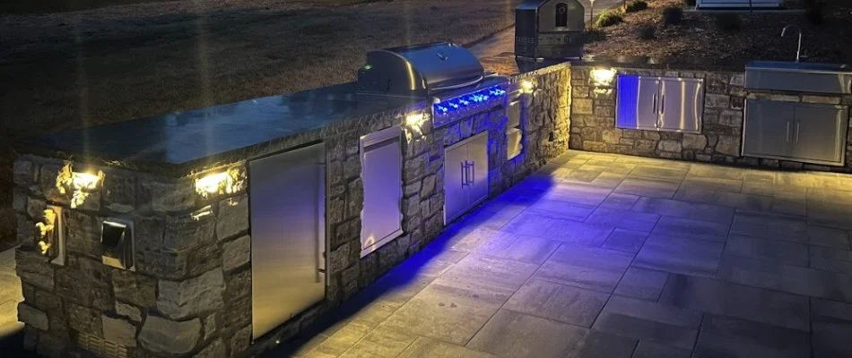 Outdoor kitchen at night on a property in Edwardsville, IL.