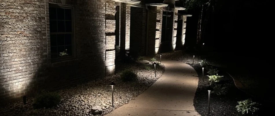 Outdoor lighting illuminating a pathway on a property in Edwardsville, IL.