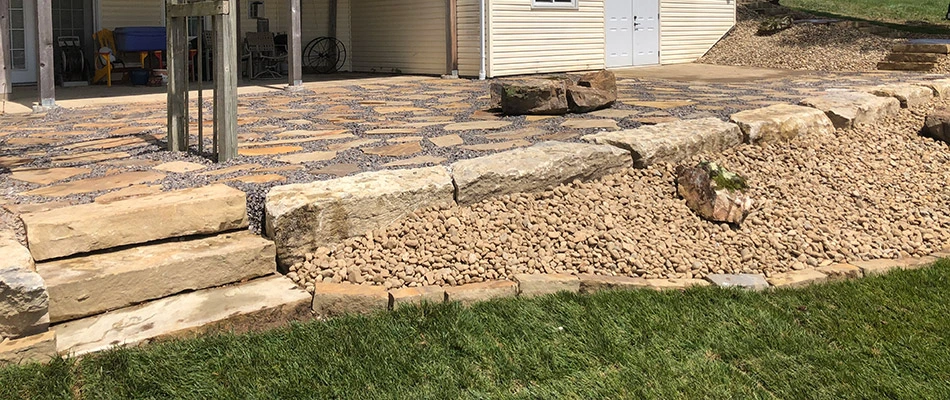 A raised flagstone patio built on a property in Holiday Shores, IL.