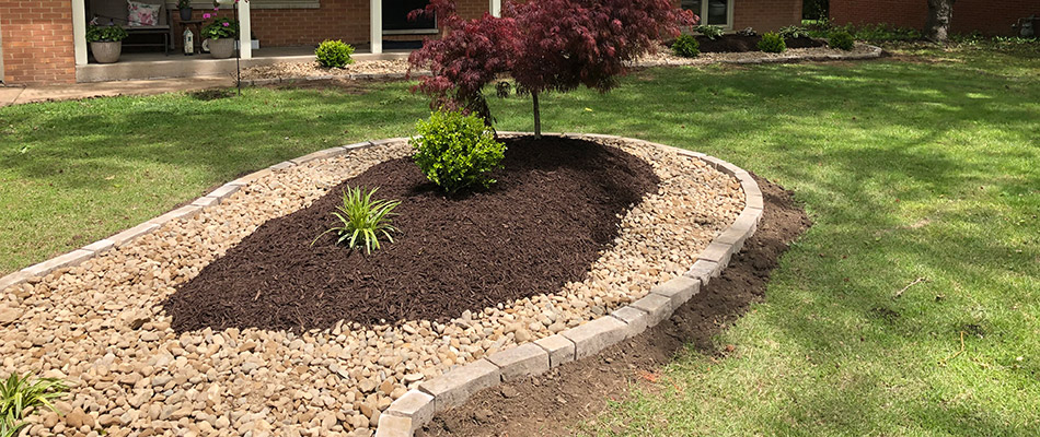 A rounded landscape bed recently renovated at a home property in Glen Carbon, IL.