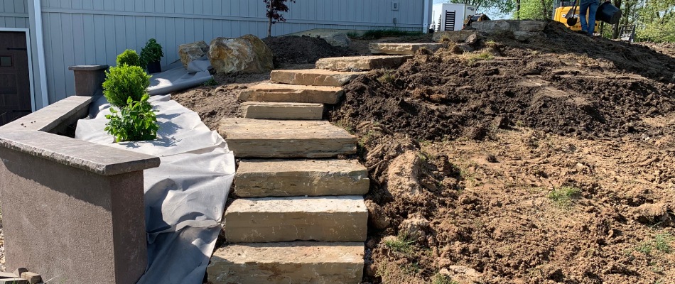 Rustic slabs added to outdoor step installation project in Greenville, IL.