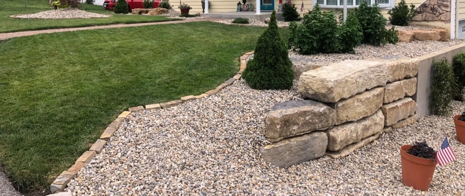 Stone retaining wall built for a sloped property in Jerseyville, IL.
