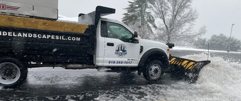 Truck pushing snow on parking lot in Edwardsville, IL.