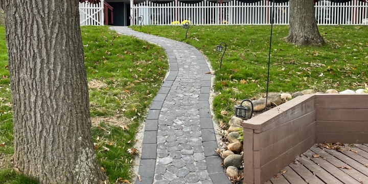 Cobblestone walkway installed in backyard.