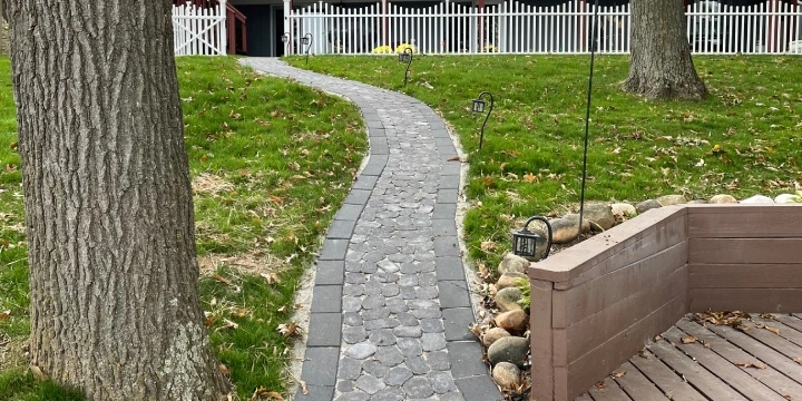 Cobblestone walkway installed in backyard.