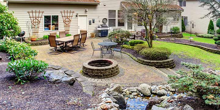 Fire pit and patio with custom landscaping at a home in Edwardsville, IL.