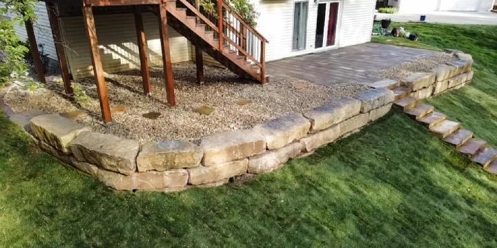 Retaining stone wall built in backyard.
